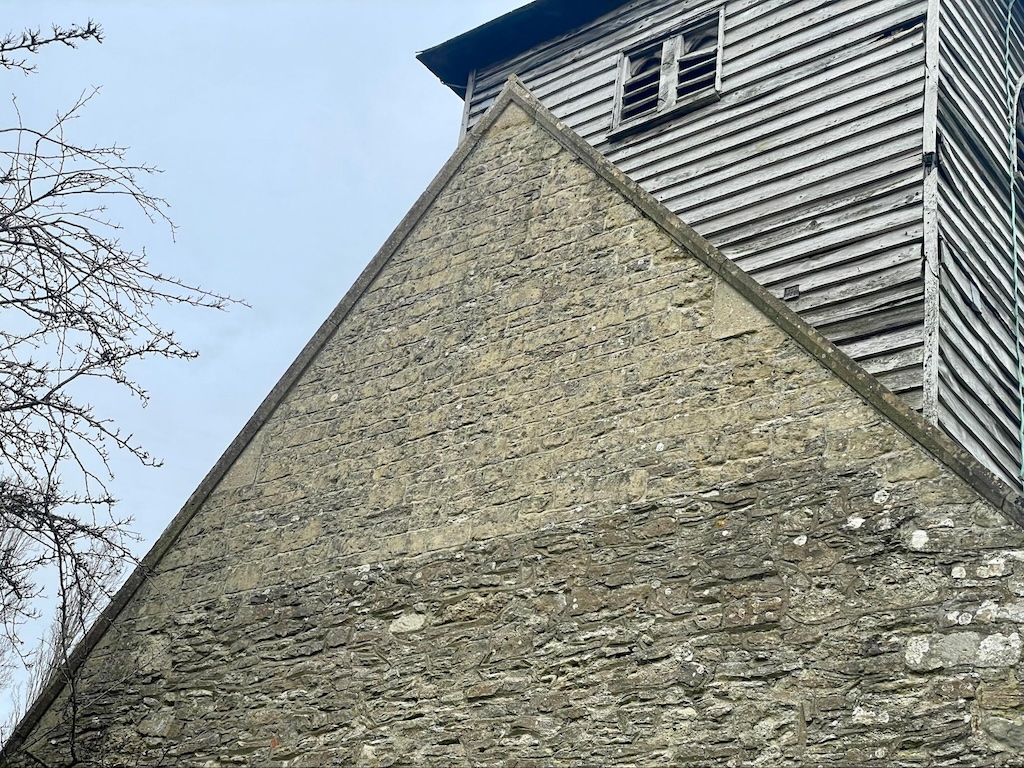 Stonework showing where the Half Hip roof was converted to a full gable end